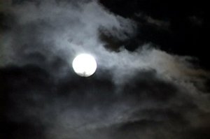 stock-footage-time-lapse-of-glowing-full-moon-at-night-as-clouds-move-pass-rapidly